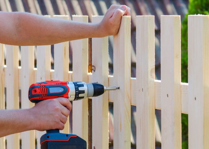 traditional wood fence being installed in Kansas City